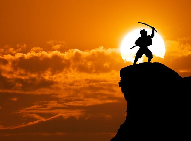 Samurai on top of mountain.