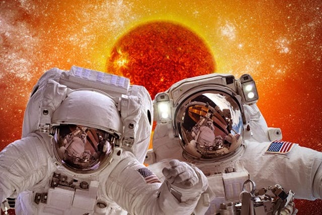 astronauts in space on background sun star