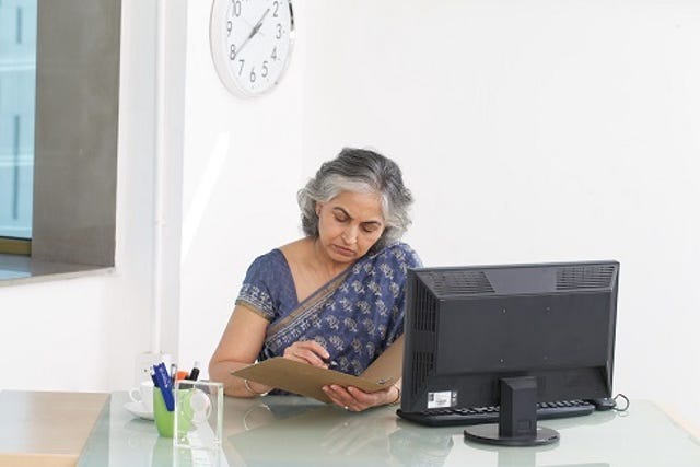 beautiful aging Indian women in an office environment