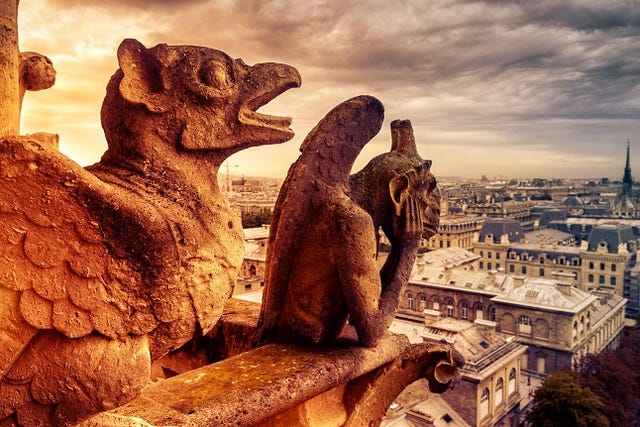 Gargoyles or chimeras on the Notre Dame de Paris overlooking Paris