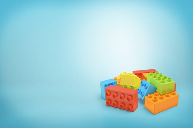 colorful Lego building blocks on a blue background