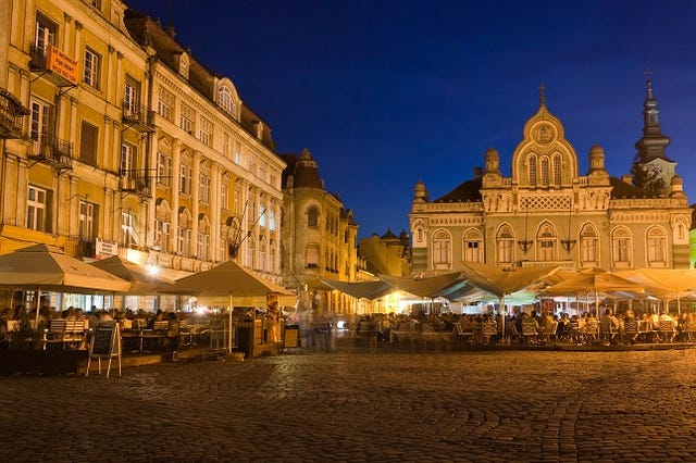 nighttime scene at a plaza in Timisoara, Romania