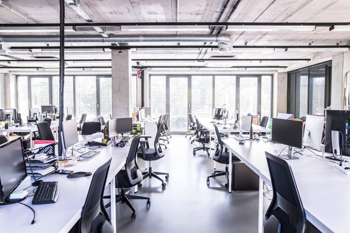 business office with desks and chairs but nobody is there