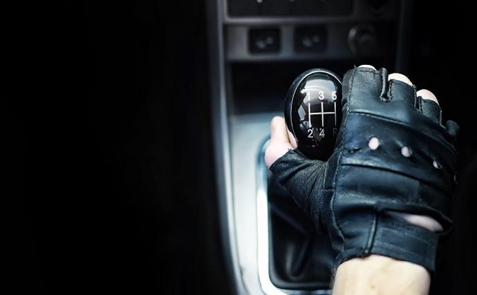 Gear lever. Manual Transmission. Hand on the gear shift in a car.